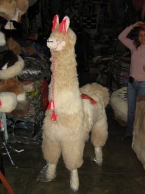 Life-sized alpaca made of fur, swing toy 160 cm