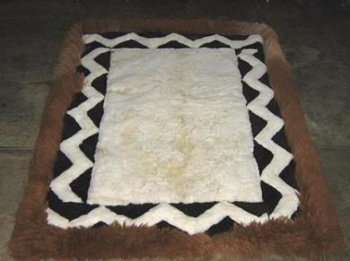 White, brown alpaca fur rug with designs